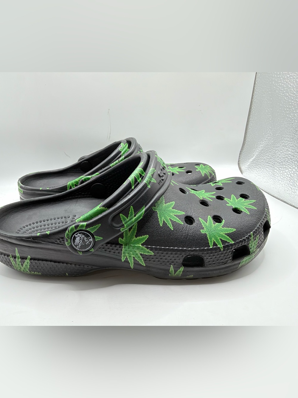 CROCS Kids Black Clogs with Green Leaf Print